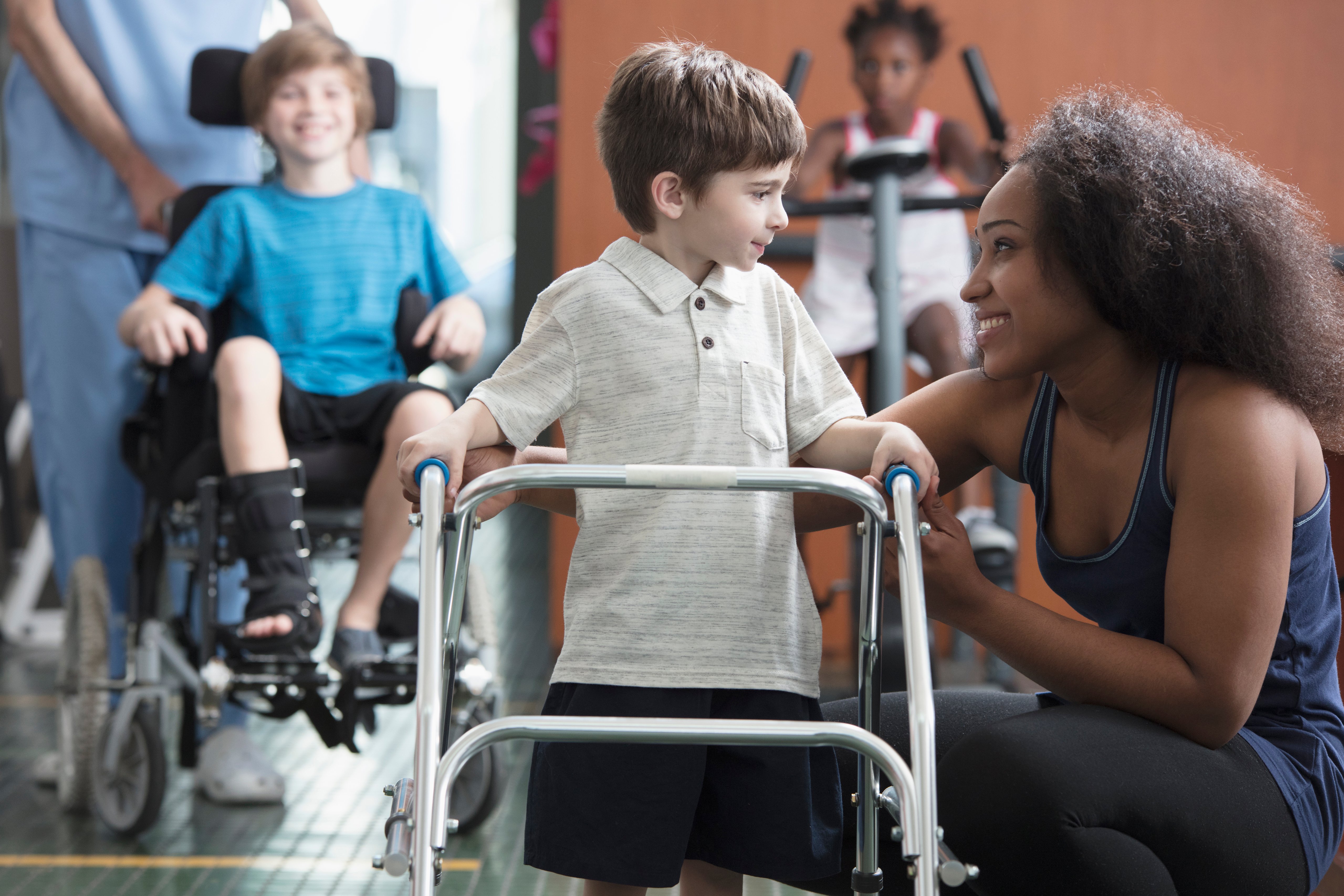 Young boy and physical therapist